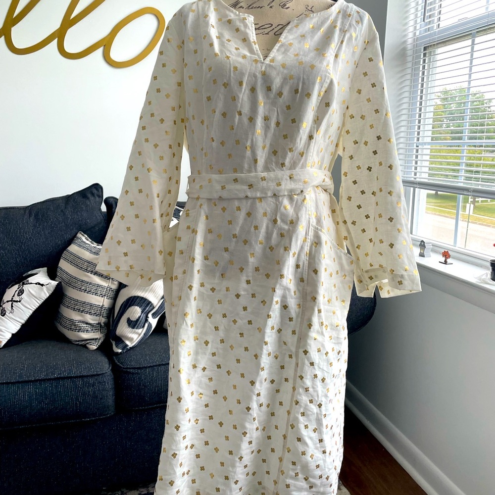 Shirt dress with tie around the waist to accent the curves.